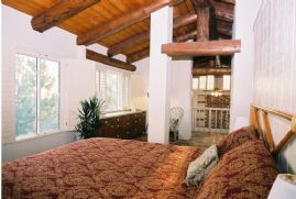 Master bedroom with beamed cielings and pano views
